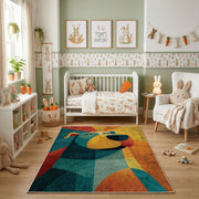 Colorful geometric bear rug shown beside a child's bed