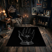 Mystical Hand Line Art Area Rug styled in a candlelit gothic living room
