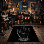 Mystical Hand Line Art Area Rug front view in a warm candlelit room