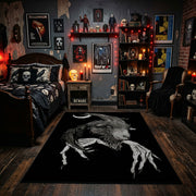 Moonlit Horned Figure Area Rug displayed beneath gothic wall art