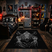 Antlered Skull Crescent Area Rug displayed beneath gothic wall art