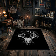 Minimal Horned Skull Emblem Area Rug shown in a candlelit dark room