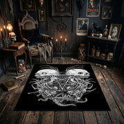 Twin Horned Skulls Occult Area Rug shown in a candlelit dark room