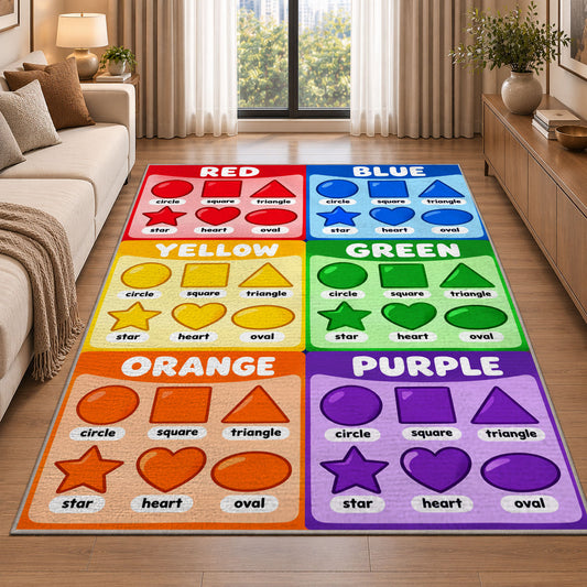Rainbow Shapes Color Chart Rug shown beside a sofa in a bright living room