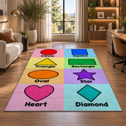 Pastel Shapes Learning Rug shown near large windows and a sofa
