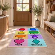 Pastel Shapes Learning Rug shown in an entryway near a wooden door