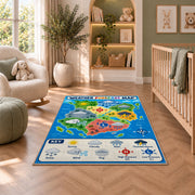 Weather world map rug in a bright room with a reading chair and storage cabinet