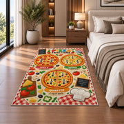 Pizza Fractions Learning Rug shown beside a bed with neutral bedding