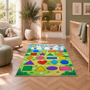 Find the Shape Challenge Rug shown in a nursery with a cot and soft toys