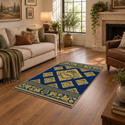 Decorative navy rug with symmetrical gold details