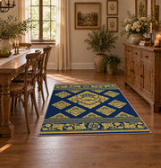 Rectangular navy area rug styled on a wood floor