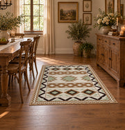 cream and black southwestern diamond pattern area rug, close decorative detail