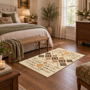 cream and tan patchwork kilim pattern area rug, cozy home setting