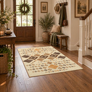 cream and tan patchwork kilim pattern area rug, close decorative detail