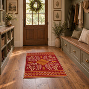 red and gold folk art floral pattern area rug, front room mockup