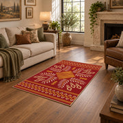 red and gold folk art floral pattern area rug, ornamental detail view