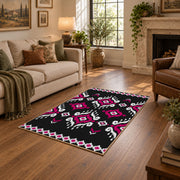 black and magenta tribal diamond pattern area rug, cozy home setting