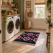 black and magenta tribal diamond pattern area rug, ornamental detail view