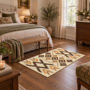 tan and orange zigzag tribal pattern area rug, cozy home setting