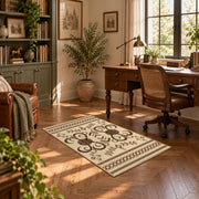 cream and brown ornamental scroll pattern area rug, complete product view