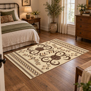 cream and brown ornamental scroll pattern area rug, soft surface detail