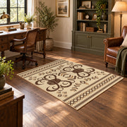cream and brown ornamental scroll pattern area rug, wood floor styling