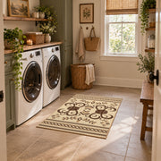 cream and brown ornamental scroll pattern area rug, wide interior view