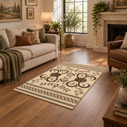 cream and brown ornamental scroll pattern area rug, ornamental detail view