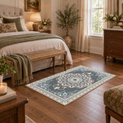 teal and gray ornate floral medallion area rug, cozy home setting