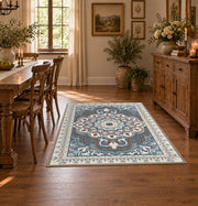 teal and gray ornate floral medallion area rug, close decorative detail