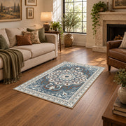 teal and gray ornate floral medallion area rug, ornamental detail view