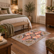coral and blue decorative elephant and paisley motif area rug, cozy home setting