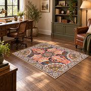 coral and blue decorative elephant and paisley motif area rug, soft surface detail