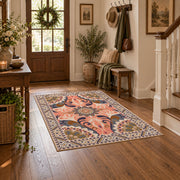 coral and blue decorative elephant and paisley motif area rug, wood floor styling