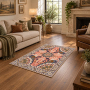coral and blue decorative elephant and paisley motif area rug, ornamental detail view