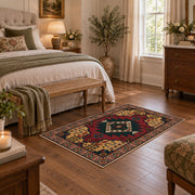 red and navy Persian inspired diamond medallion area rug, cozy home setting
