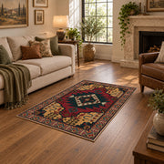 red and navy Persian inspired diamond medallion area rug, ornamental detail view