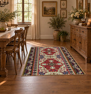 red and cream Persian inspired floral pattern area rug, warm living room view