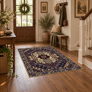purple and gold ornate medallion pattern area rug, close decorative detail