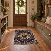 purple and gold ornate medallion pattern area rug, wide interior view