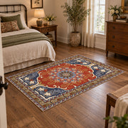 burnt orange and blue floral medallion pattern area rug, soft surface detail