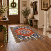 burnt orange and blue floral medallion pattern area rug, close decorative detail