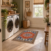 burnt orange and blue floral medallion pattern area rug, wide interior view