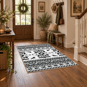 black and white tribal wildlife pattern area rug, wood floor styling