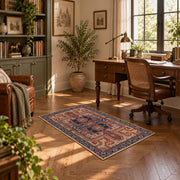 terracotta and blue distressed tribal pattern area rug, warm living room view