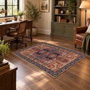 terracotta and blue distressed tribal pattern area rug, wood floor styling