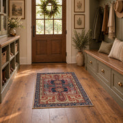 terracotta and blue distressed tribal pattern area rug, wide interior view