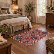 red and blue kilim patchwork pattern area rug, cozy home setting