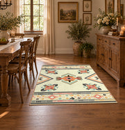 cream and multicolor folk botanical pattern area rug, close decorative detail