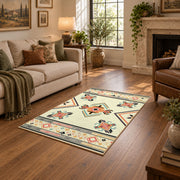 cream and multicolor folk botanical pattern area rug, ornamental detail view